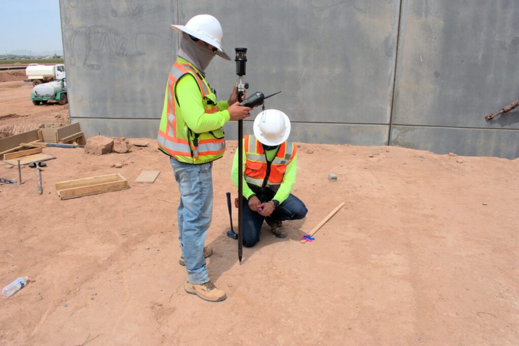 A Team Professional Associates field crew performing construction staking and data collection at an active job site in Arizona. Photo by Jackson Kern.