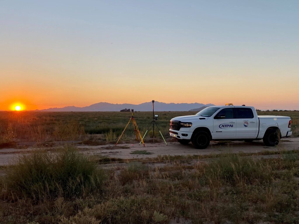 A Team Professional Associates survey truck and equipment setup during sunset at a Gila River Indian Community (GRIC) project site in Arizona. Photo by Nathan Robinson.