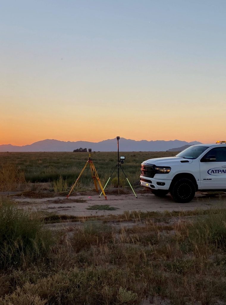 A Team Professional Associates survey truck and equipment setup during sunset at a Gila River Indian Community (GRIC) project site in Arizona. Photo by Nathan Robinson.